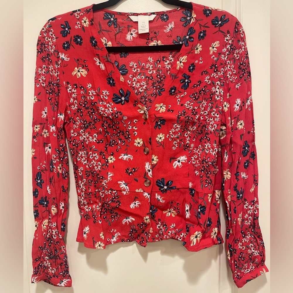 H&M red top size 8 (M),long sleeves and charming floral details.